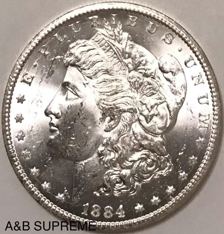 1884 CC Morgan Dollar From OBW Estate Roll GEM Bu Unc. 90% Silver Coin Shown*